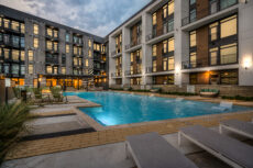 Modern Houston multifamily exterior photographed at twilight