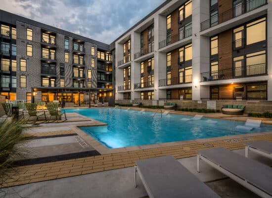 Modern Houston multifamily exterior photographed at twilight