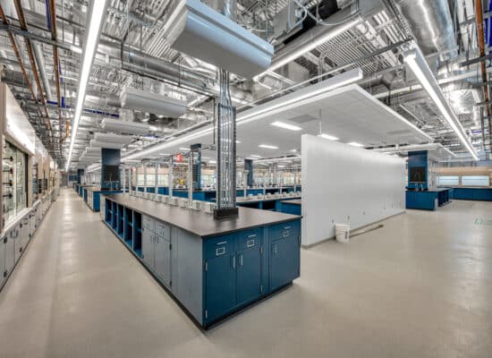 Industrial interior photography showcasing pipes, valves, and equipment