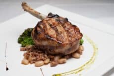 plated steak dish with vegetables restaurant photography Houston