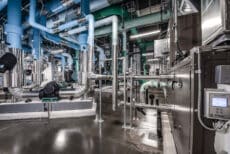 Houston energy facility interior with large-scale equipment and piping