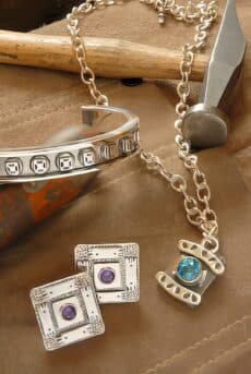 silver jewelry set with bracelet earrings product photography Houston